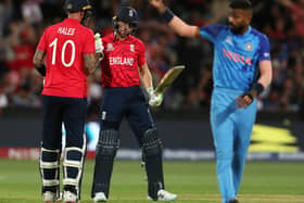 Alex Hales of England congratulates  Jos Buttler of England on his 50th run during the ICC Men's T20 World Cup Semi Final match between India and England at Adelaide Oval on November 10