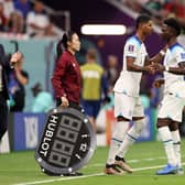 Marcus Rashford and Bukayo Saka of England are substituted during the FIFA World Cup Qatar 2022 Group B match between England and USA at Al Bayt Stadium on November 25, 2022 in Al Khor, Qatar. (Photo by Elsa/Getty Images)