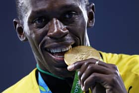 Gold medalist Usain Bolt of Jamaica stands on the podium during the medal ceremony for the Men’s 4 x 100 meter Relay on Day 15 of the Rio 2016 Olympic Games at the Olympic Stadium on August 20, 2016 in Rio de Janeiro, Brazil.  (Photo by Patrick Smith/Getty Images)
