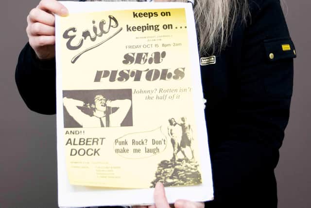 Claire Howell, music memorabilia consultant at Hansons Auctioneers, with the Sex Pistols poster.