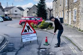 Ben Thornbury demonstrating 'crazy pothole golf' in Malmesbury