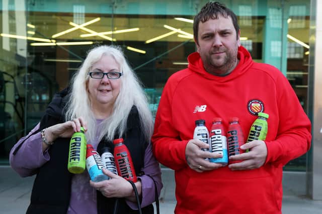 Pam Ryan, 59, and Gavin Ryan, 41, both from Manchester are at Aldi in Ancoats, Manchester today to buy the new flavours of the viral energy drink Prime, which is limited to one flavour per customer. (SWNS)
