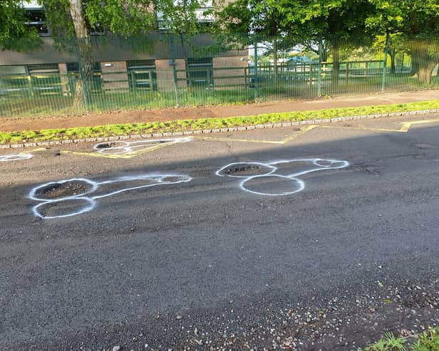 Locals appear to have lost patience waiting for the holey highway in East Sussex to be repaired - and the resulting crude phallus drawings have attracted interest online. 
