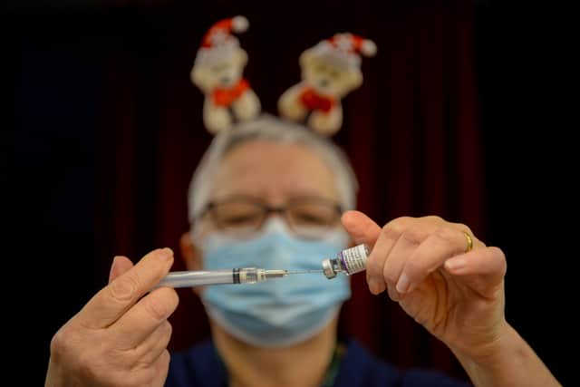 Pfizer BioNTech vaccines are prepared at Army Reserve Centre on December 23, 2021 in Poole, England. (Photo: Getty)