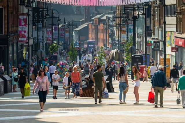 Members of the public enjoying the warm weather in the centre of Leeds (photo: James Hardisty)