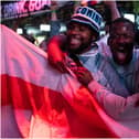 England fans cheer as they watch a live broadcast of the semi-final match between England and Denmark  (Getty Images)
