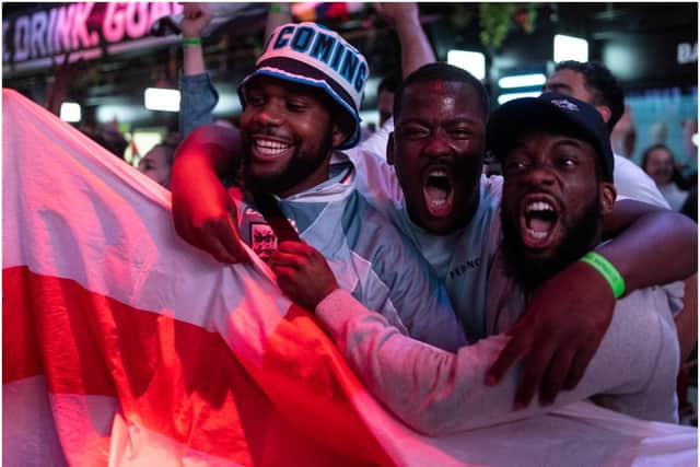 England fans cheer as they watch a live broadcast of the semi-final match between England and Denmark (Getty Images)
