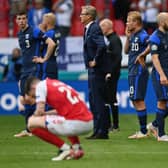 Markku Kanerva, Head Coach of Finland and Teemu Pukki of Finland wait on the pitch as Christian Eriksen (Not pictured) of Denmark receives medical treatment during the UEFA Euro 2020 Championship Group B match between Denmark and Finland on June 12, 2021 in Copenhagen, Denmark. (Photo by Stuart Franklin/Getty Images)