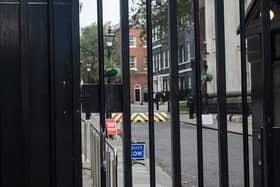 A car has crashed into the gates leading to the British government buildings on Downing Street 