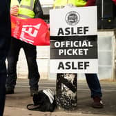 LONDON, ENGLAND - MAY 31: A group of rail workers stand on a picket line outside Euston rail station as a new round of strikes by train drivers begins on May 31, 2023 in London, England. Today's strike comes after the train drivers union, ASLEF, rejected a pay rise offer of 4 percent a year over two years from the Rail Delivery Group (RDG). (Photo by Leon Neal/Getty Images)