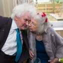 Joan Neininger & Ken Selway share a kiss at their wedding reception at Hannover Court, Cinderford, Gloucestershire. 