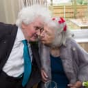 Joan Neininger & Ken Selway share a kiss at their wedding reception at Hannover Court, Cinderford, Gloucestershire. 