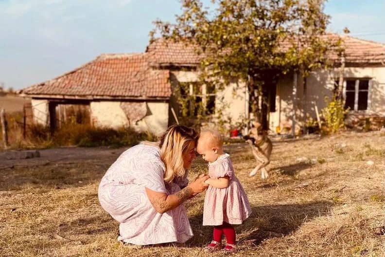 Jordan and Fae Vye outside their farmhouse in Bulgaria.