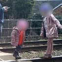 Shocking footage shows young children being played on the tracks 