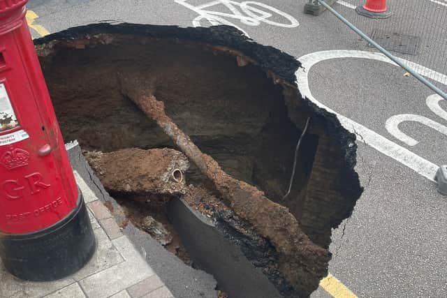 A mysterious sinkhole the size of a car has appeared on a UK street