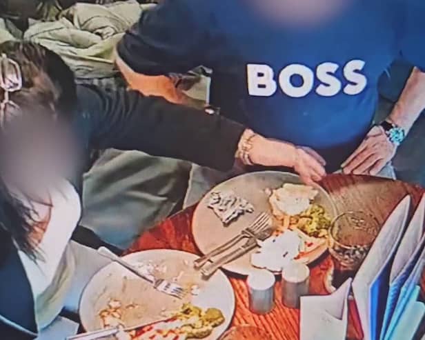 A pub customer has been caught on CCTV placing their own hair into their food in an attempt to get a refund for their meal. (Credit: Tom Croft / SWNS)
