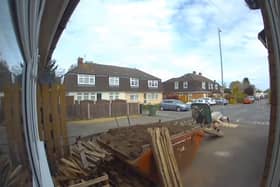 Man covers himself in soil after wheelbarrow tips over.