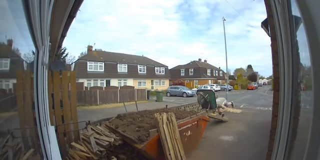 Man covers himself in soil after wheelbarrow tips over.