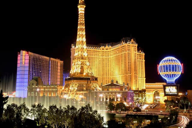 Water from the Bellagio's fountain show is seen in front of the Bally's Las Vegas (L) and Paris Las Vegas, including the Paris' 50-story Eiffel Tower replica, June 30, 2005 in Las Vegas, Nevada