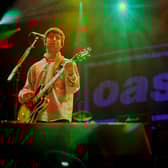 Noel Gallagher of Oasis performs on stage. Photo: Stacia Timonere/Getty Images