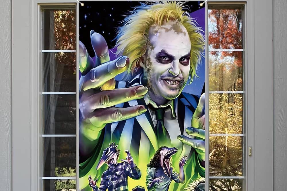 Beetlejuice themed Halloween decorations like this door cover are all the rage this year