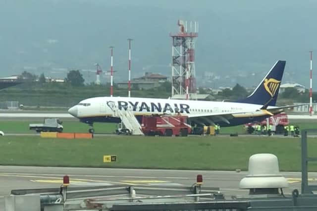 Engineers work on the Ryanair plane.