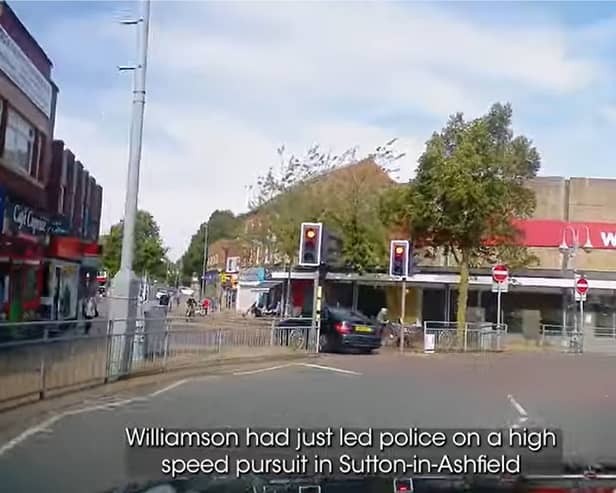 Dangerous driver narrowly avoids hitting woman with a pram.