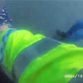 Drunk driver falls over on M1 as she’s walked to police car.