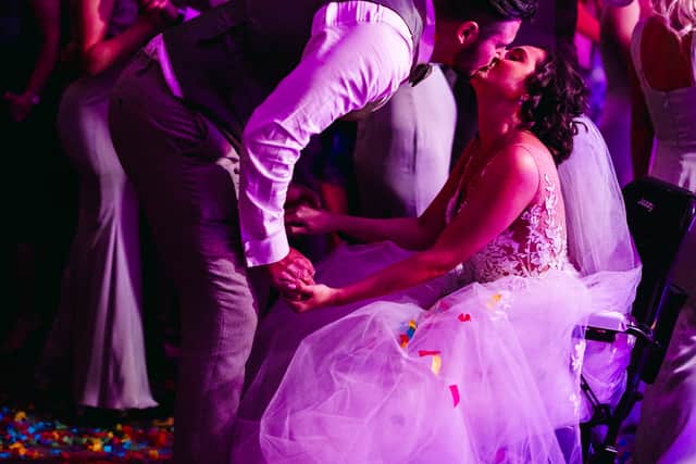 A bride given less than six months to live after losing her leg to cancer made it down the aisle to marry her partner -for the second time.