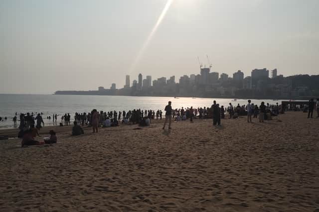 Families gather before sunset on Mumbai's Chowpatty beach 