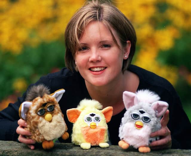 Emma Carle pictured with a family of Furbies in 1999
