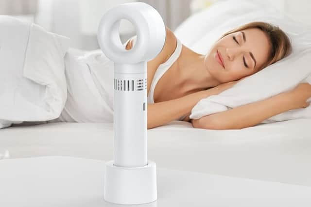 It's quiet enough to sleep next to, and the plastic base means you can put it on any surface
