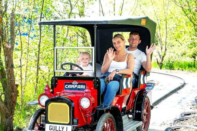 A family enjoying one of the classic rides at Gulliver’s Kingdom – a perfect summer day out for kids and parents alike.