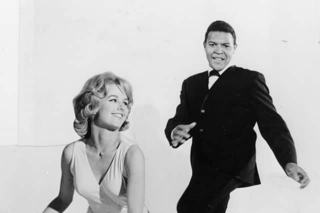 Chubby Checker performing The Twist with a friend in the early 60s