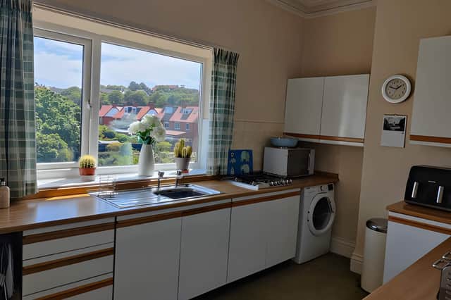 The kitchen provides a practical setting within this two-storey home