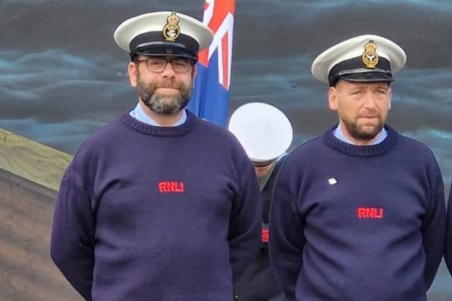 Pete Sanderson (left) and Mikey Ellison proudly display their white caps.