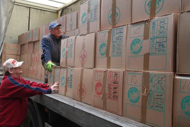 OCC volunteers get busy loading shoeboxes during last year’s campaign.