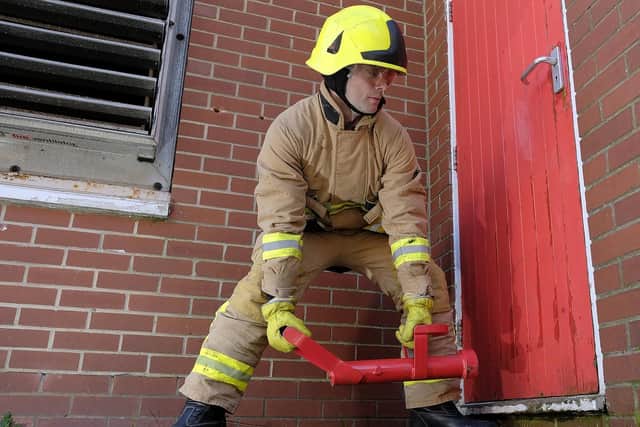Fire officer Ross Flinton with a door enforcer. Picture by Richard Ponter