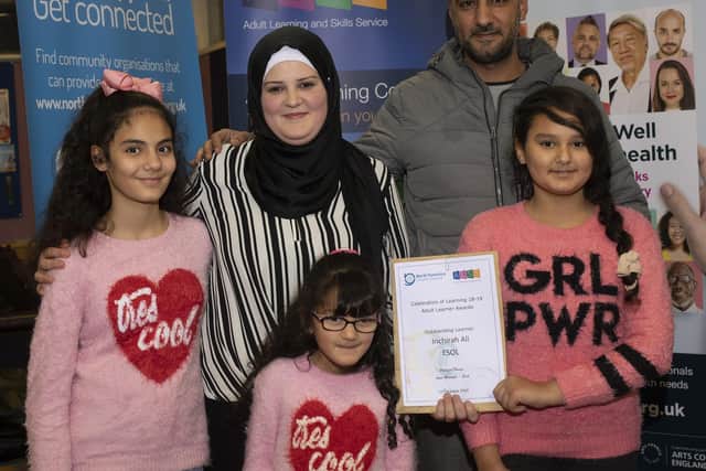 Inchirah Ali and her family with her award