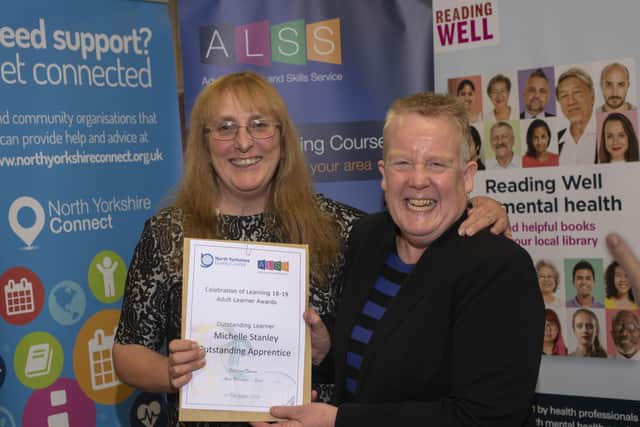 Michelle Stanley receives her award from Judith Kirk