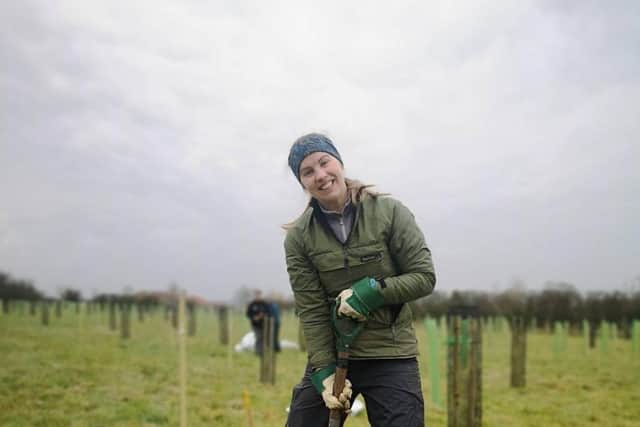 Elspeth Ingleby from North York Moors National Park Authority supporting a landowner to plant new trees.