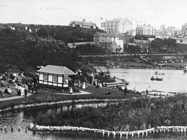 A view looking towards the Clifton Hotel and North Marine Road in the distance. The island has been further developed and people can be seen enjoying it.