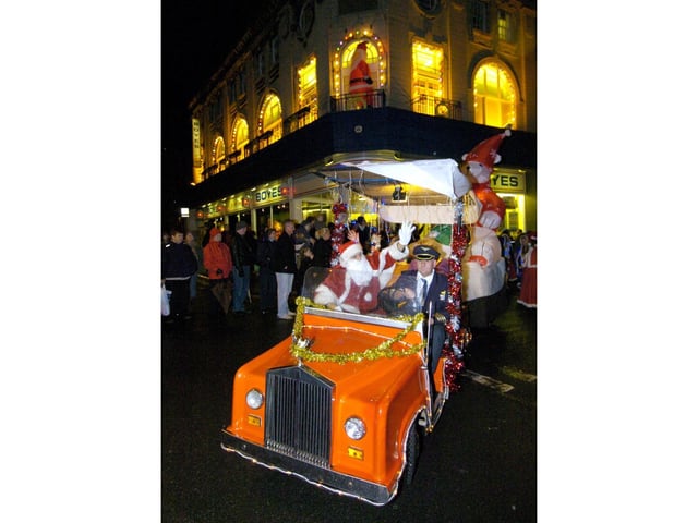 Santa leads a parade from Boyes.