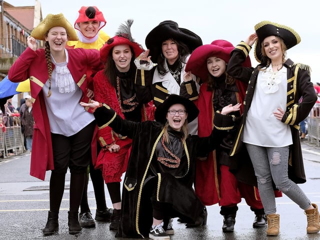 Pirates from the cast of the Stephen Joseph Theatre's Treasure Island wait to join Santa in the parade.