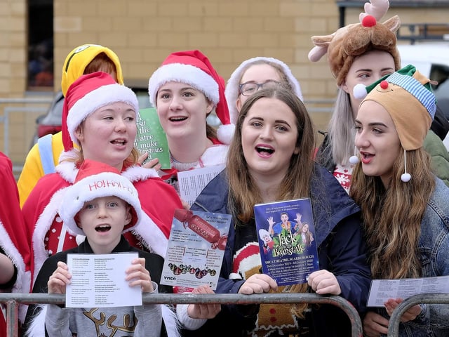 Carol singers share some Christmas cheer.