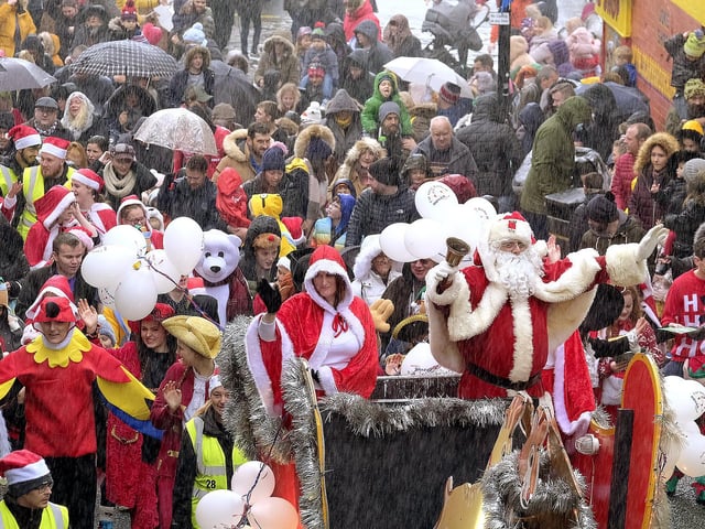 Santa head up the parade as it moves up Eastborough.