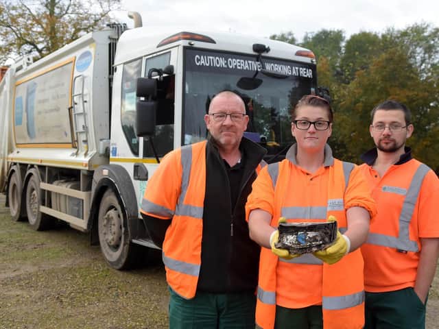 Bin crew members Brian Freeman, Emily Medforth and Paul Blewitt with the power bank that caused the fire.