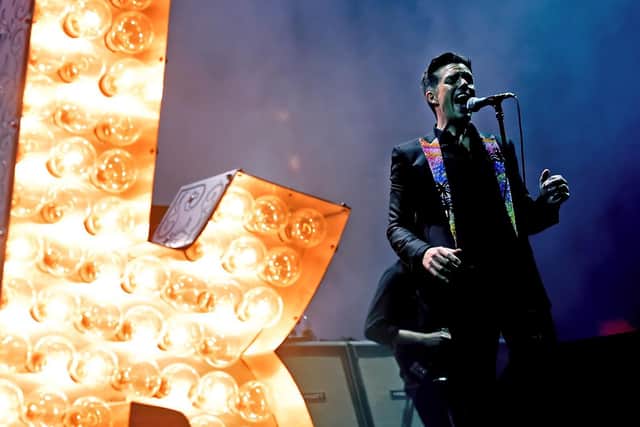 Musician Brandon Flowers of The Killers performs onstage. Photo by Kevin Winter/Getty Images