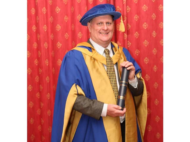 Jim Dillon with his honorary doctorate.