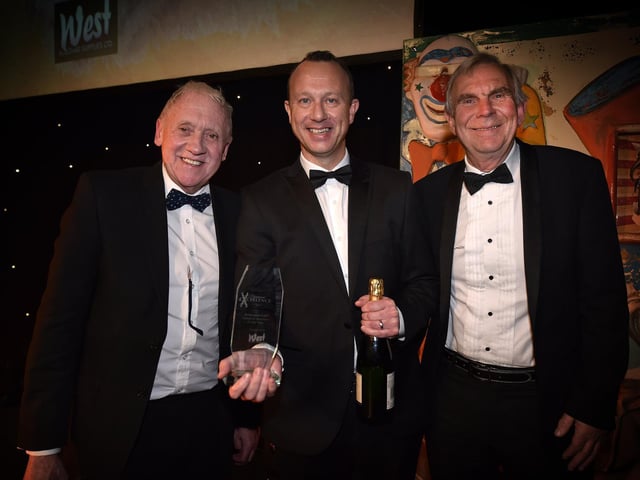 Richard Hoggart from winner Burlington Care, centre, with Harry Gration, left and Chris West from West Building Supplies.